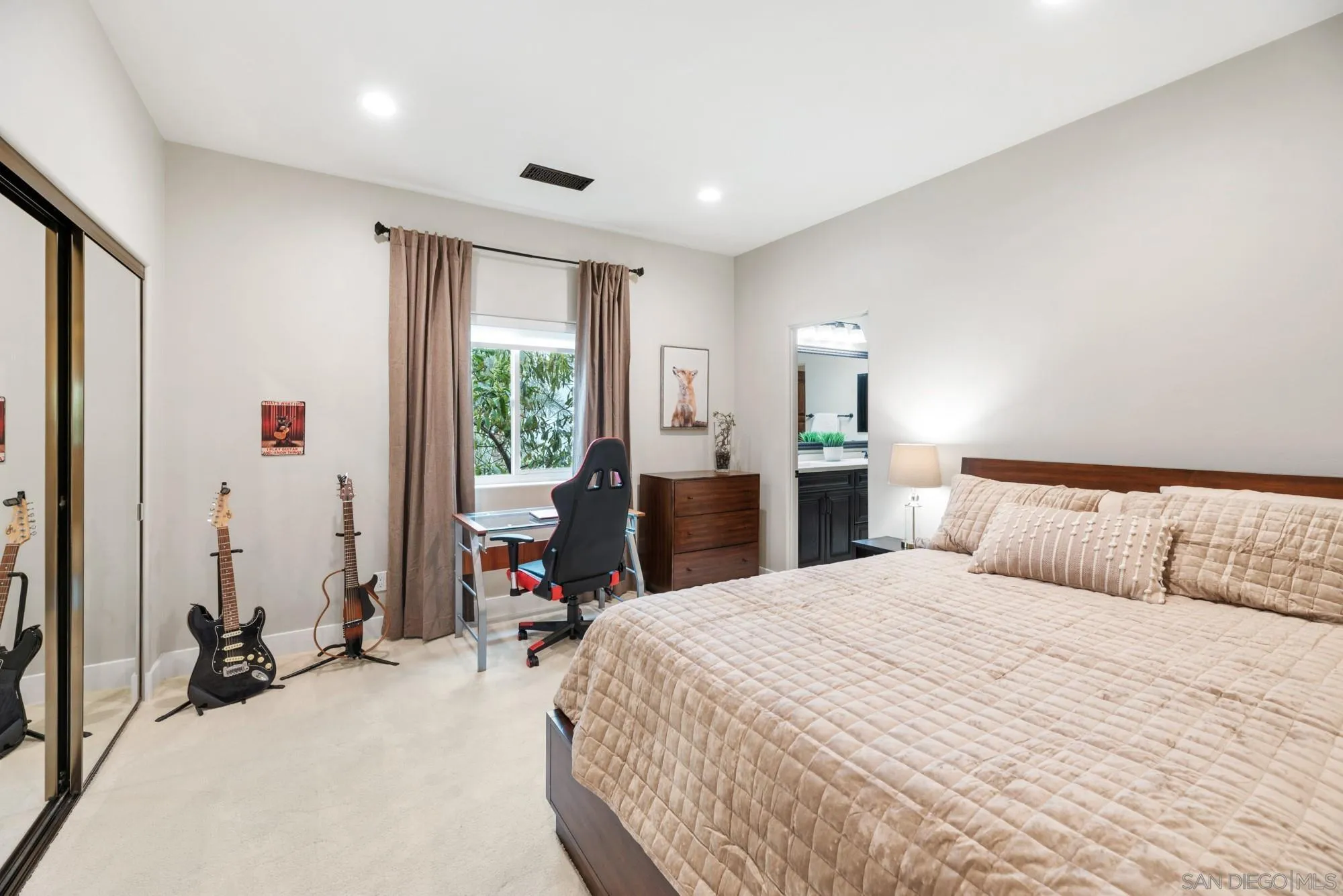 15484 Markar Road Poway, CA 92064 - Photo 44 of 75 a bed room with a bed window and a mirror