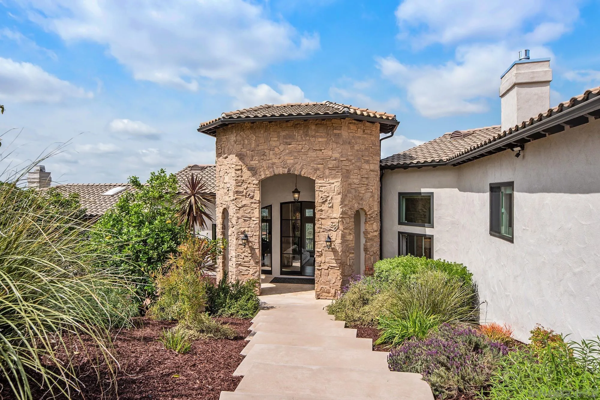 15484 Markar Road Poway, CA 92064 - Photo 5 of 75 a front view of a house with garden