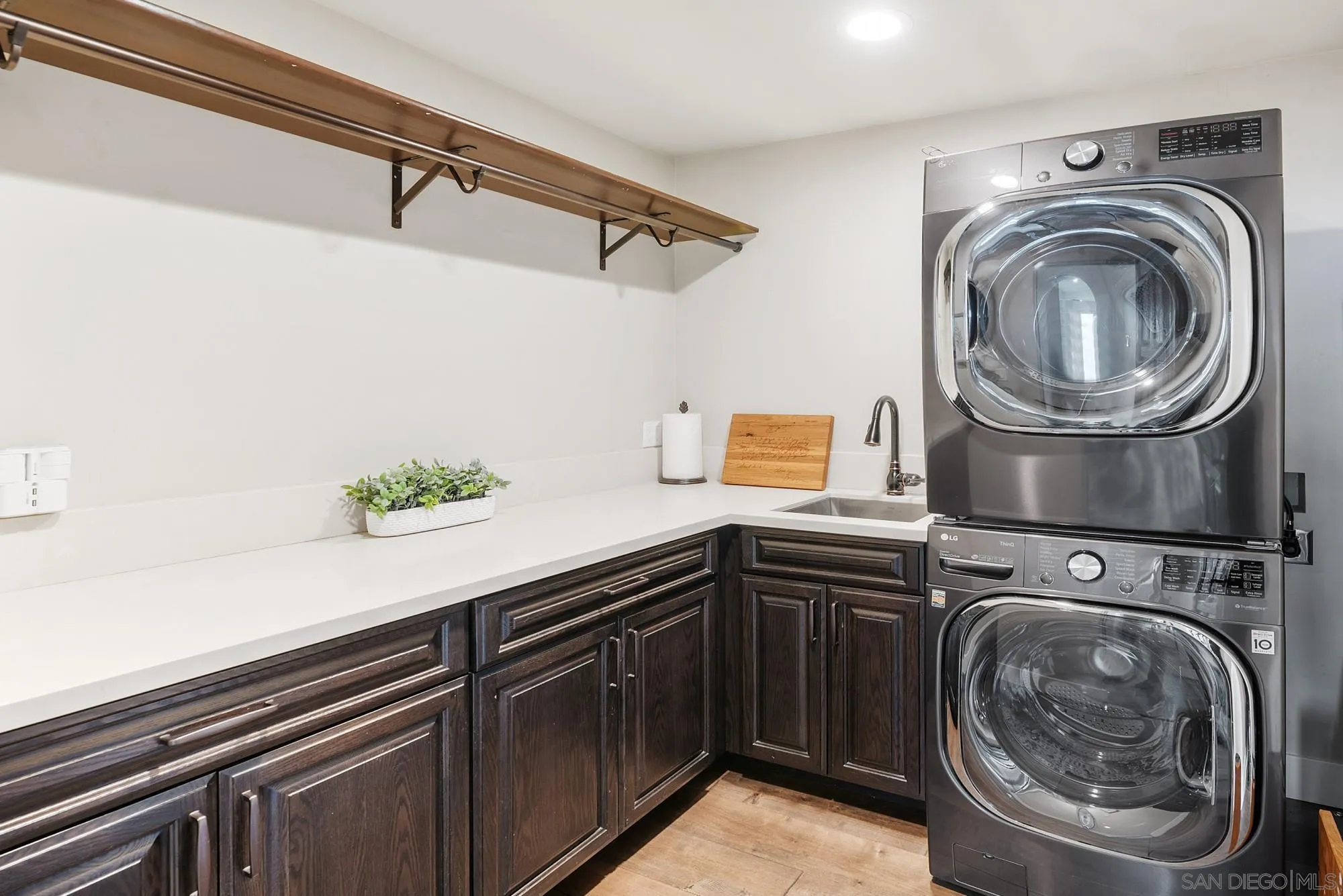 15484 Markar Road Poway, CA 92064 - Photo 51 of 75 a utility room with sink dryer and washer