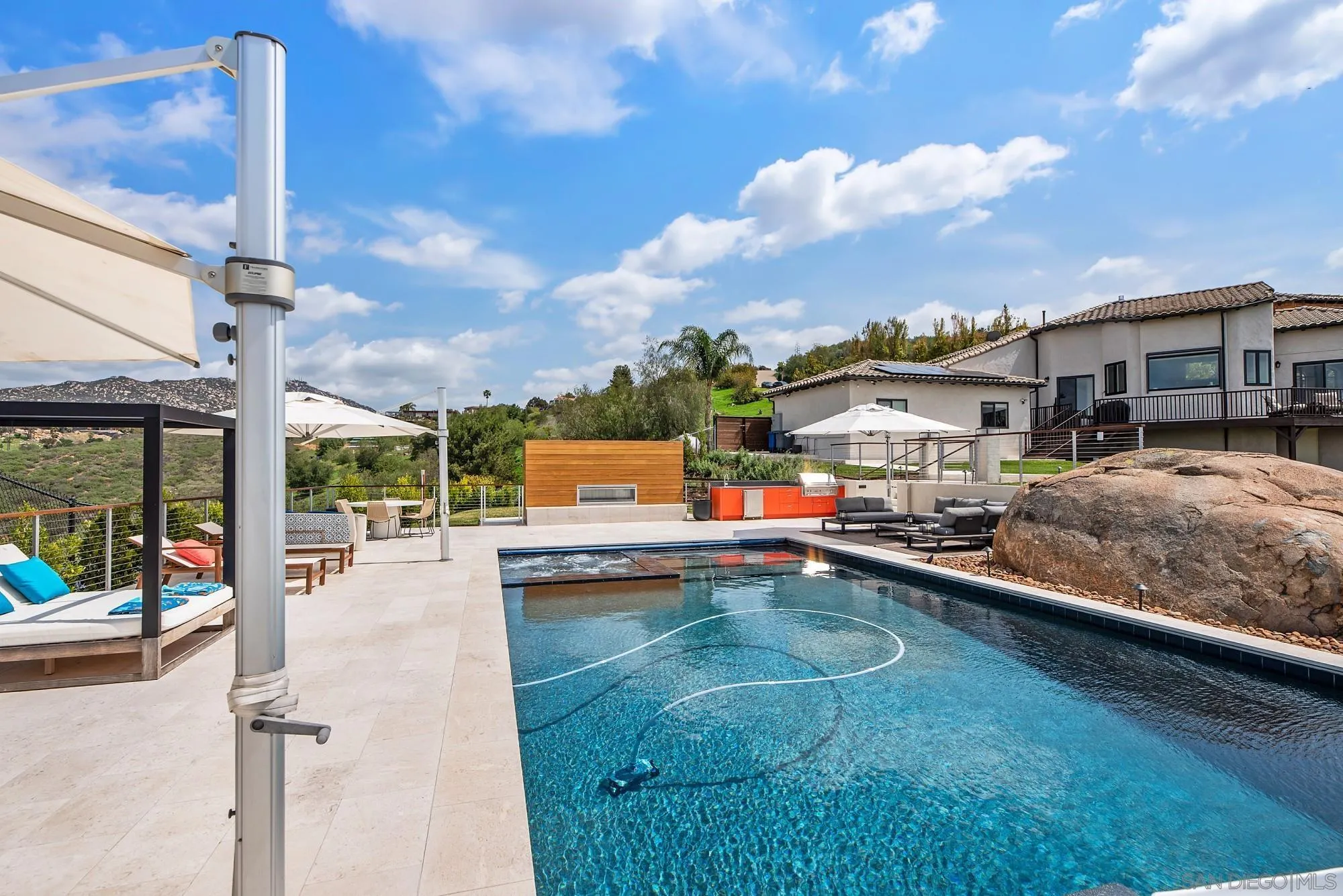 15484 Markar Road Poway, CA 92064 - Photo 61 of 75 a view of a swimming pool with a patio