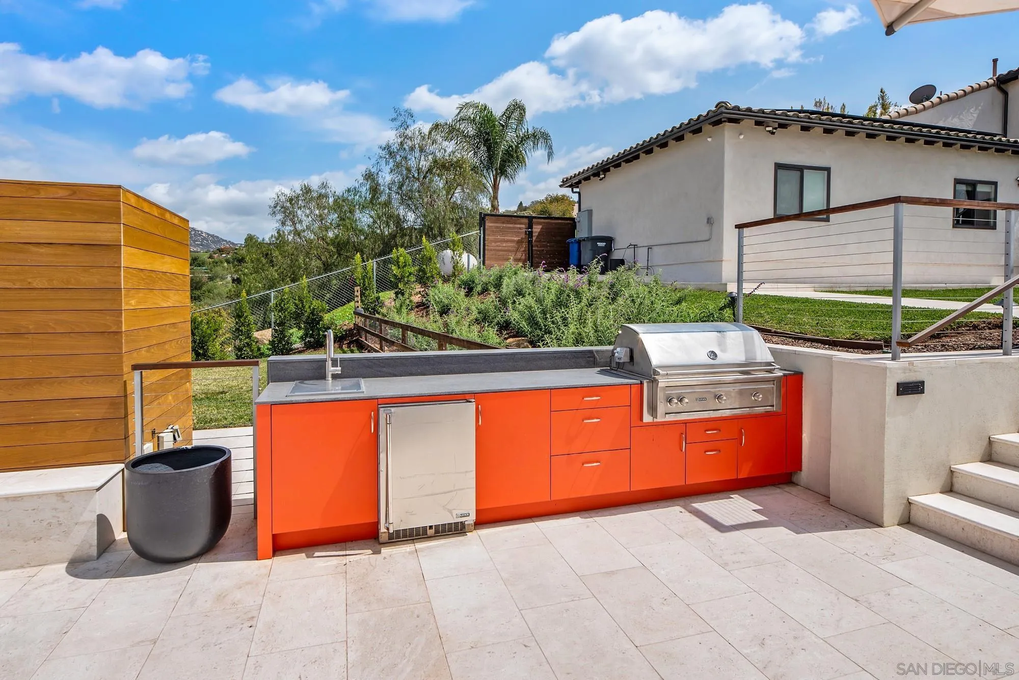 15484 Markar Road Poway, CA 92064 - Photo 64 of 75 a view of a chairs and table in the backyard