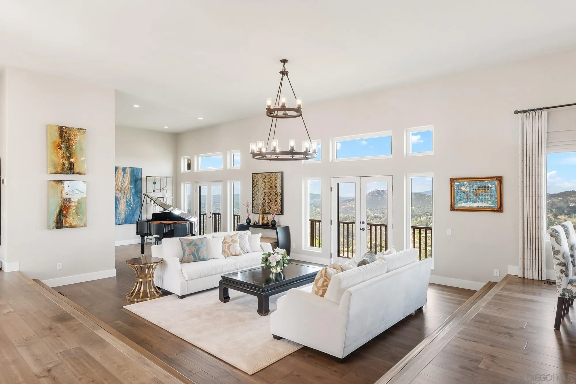 15484 Markar Road Poway, CA 92064 - Photo 9 of 75 a living room with furniture a chandelier and a chandelier