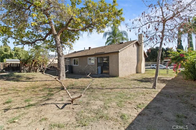 a house with trees in front of it