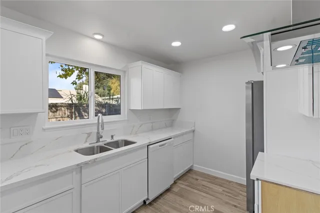 a kitchen with a sink and cabinets