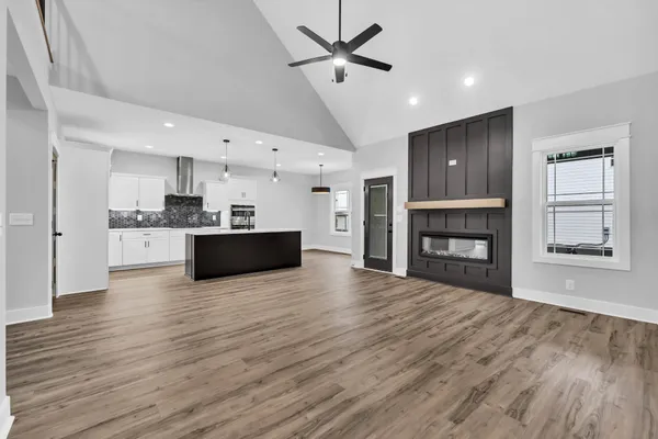 a white toilet sitting next to a white wall