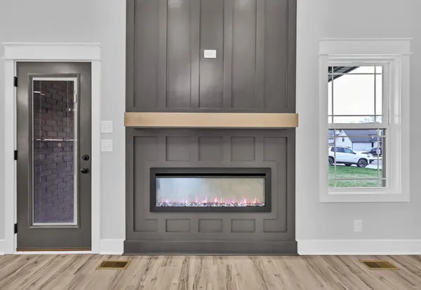 an empty room with closet and a ceiling fan