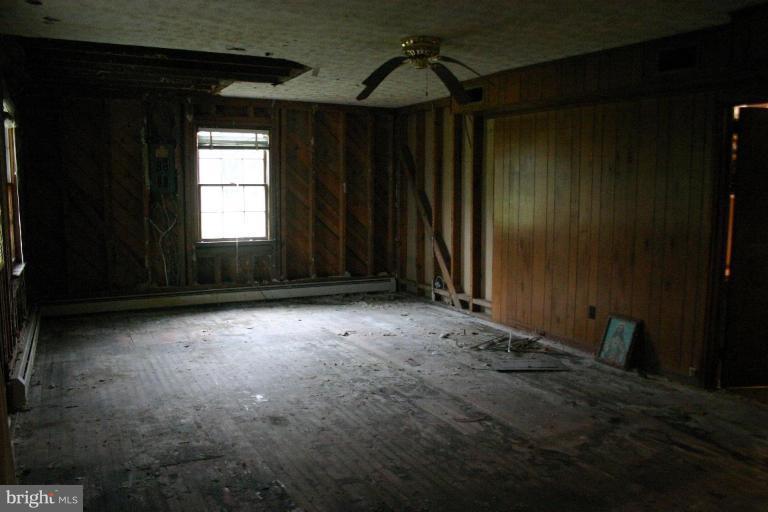 17648 Three Notch Road Dameron, MD 20628 - Photo 11 of 18 a view of room with window and hallway