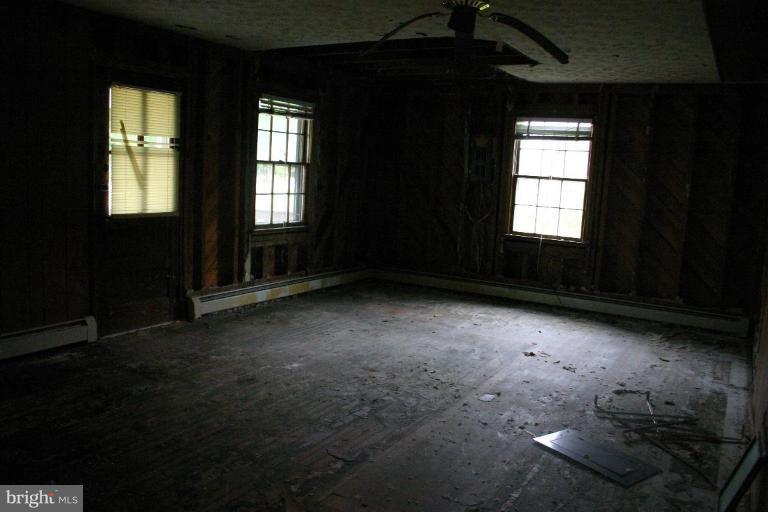 17648 Three Notch Road Dameron, MD 20628 - Photo 12 of 18 an empty room with windows