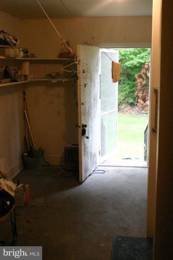 17648 Three Notch Road Dameron, MD 20628 - Photo 16 of 18 a view of empty room with a floor to ceiling window and outside view