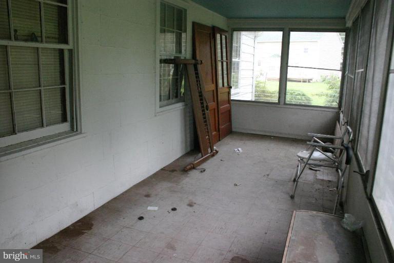 17648 Three Notch Road Dameron, MD 20628 - Photo 18 of 18 a view of an empty room with a window