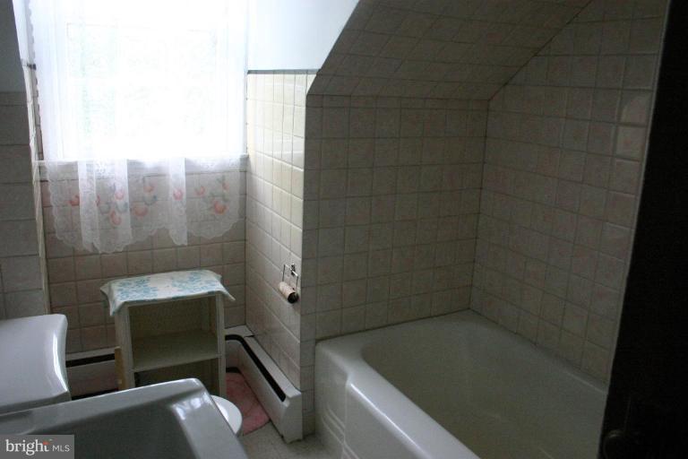 17648 Three Notch Road Dameron, MD 20628 - Photo 5 of 18 a bathroom with a bathtub