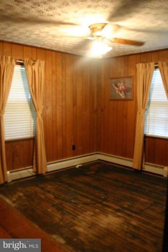 17648 Three Notch Road Dameron, MD 20628 - Photo 9 of 18 a view of an empty room with wooden floor and a window