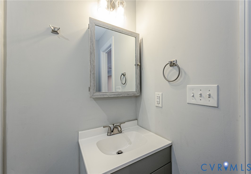 2015 Fordson Road Richmond, VA 23229 - Photo 20 of 48 Bathroom vanity featuring a single basin, gray bas