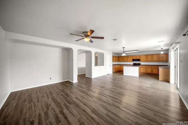 a view of a kitchen with a sink and a stove top oven