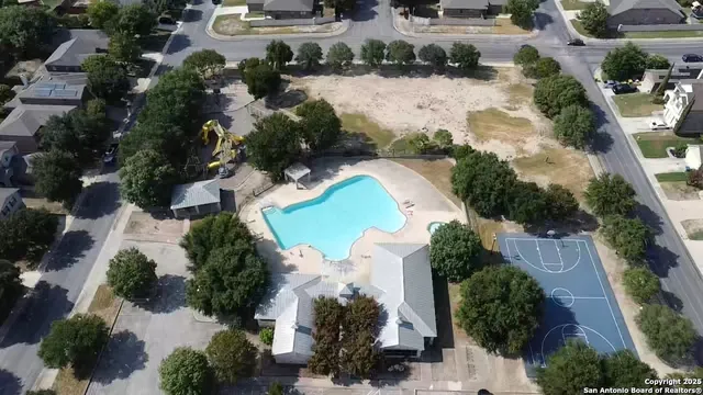 an aerial view of a house with a lake view