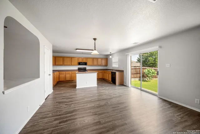 a view of kitchen with wooden floor
