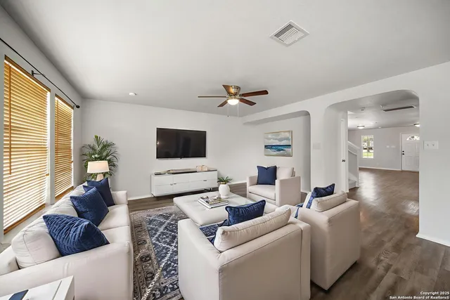 a living room with furniture and a flat screen tv