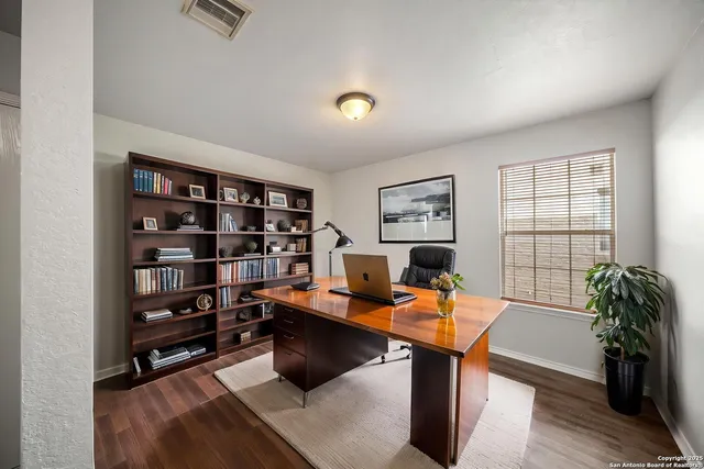 a workspace with a bookshelf