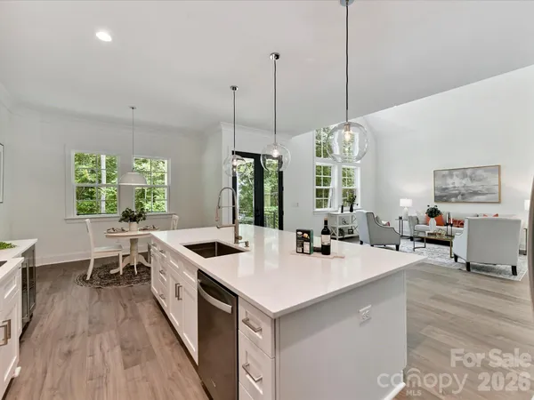 a kitchen with sink stove and window