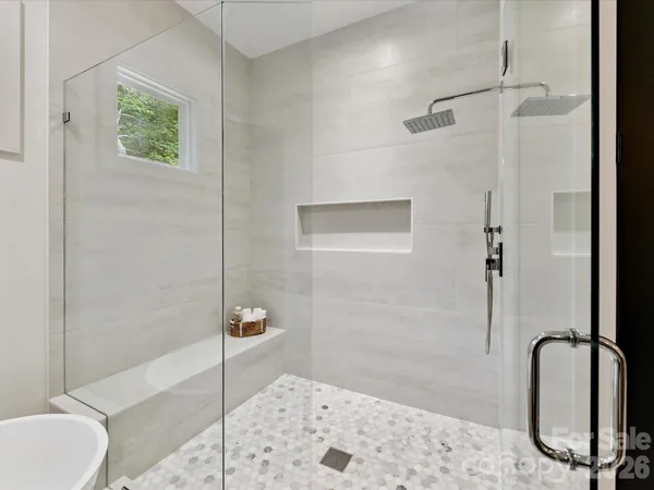 a bathroom with a granite countertop shower