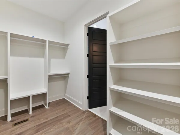 a view of an empty walk in closet