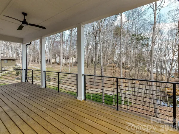 a view of a balcony with wooden floor