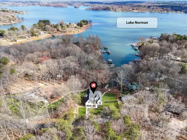a aerial view of a house with a yard