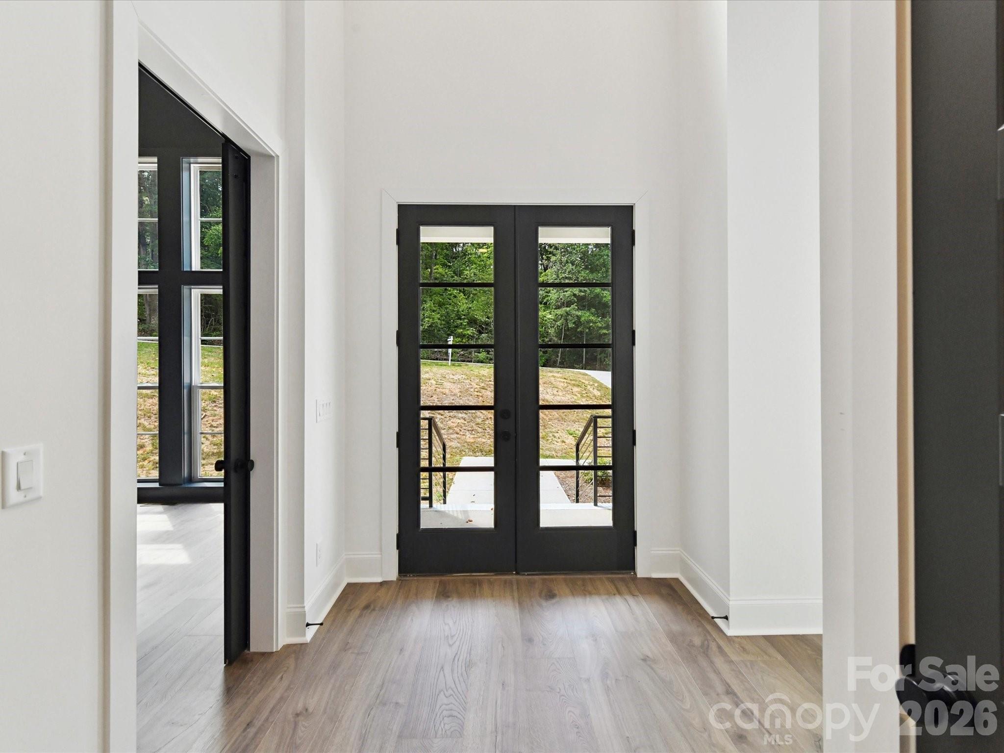 3830 Mill Run Terrell, NC 28682 - Photo 7 of 39 wooden floor in an empty room with a window