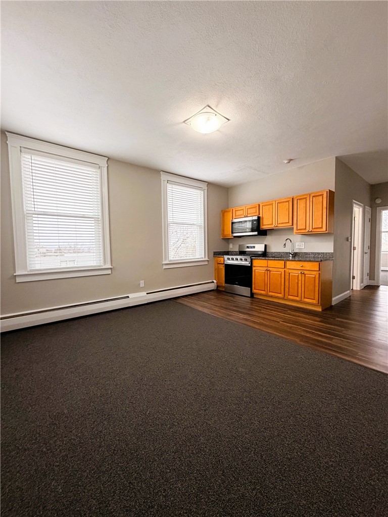 901 Bernon Street, Unit 242 Woonsocket, RI 02895 - Photo 2 of 13 Kitchen and Living Area
