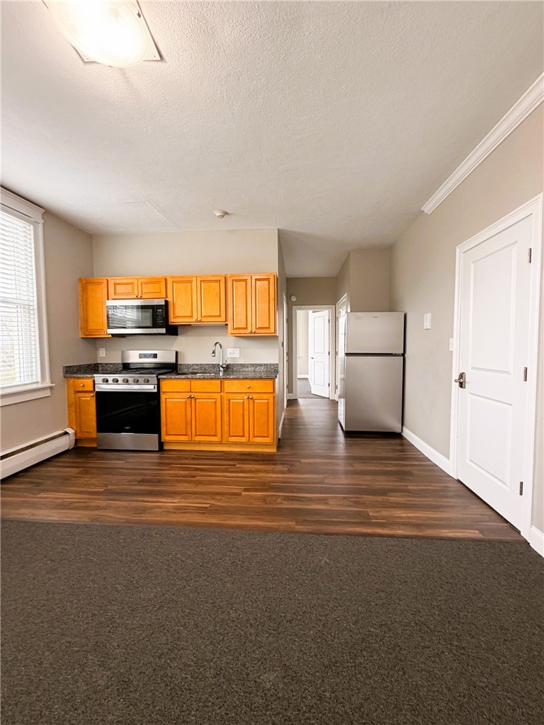 901 Bernon Street, Unit 242 Woonsocket, RI 02895 - Photo 3 of 13 Kitchen and Living Area