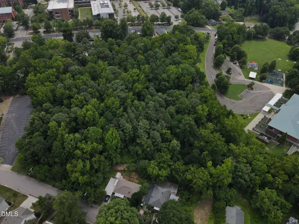 an aerial view of a house with outdoor space and street view