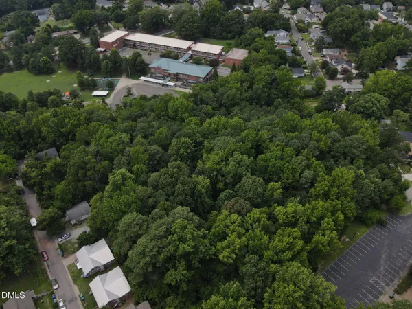 an aerial view of a house with outdoor space and street view
