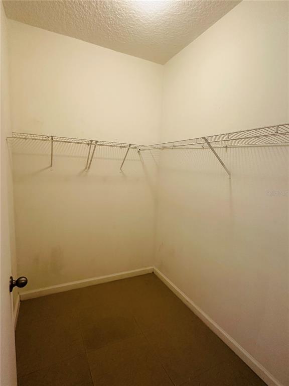 5560 Metrowest Boulevard, Unit 101 Orlando, FL 32811 - Photo 11 of 30 a view of a room with racks on the wall