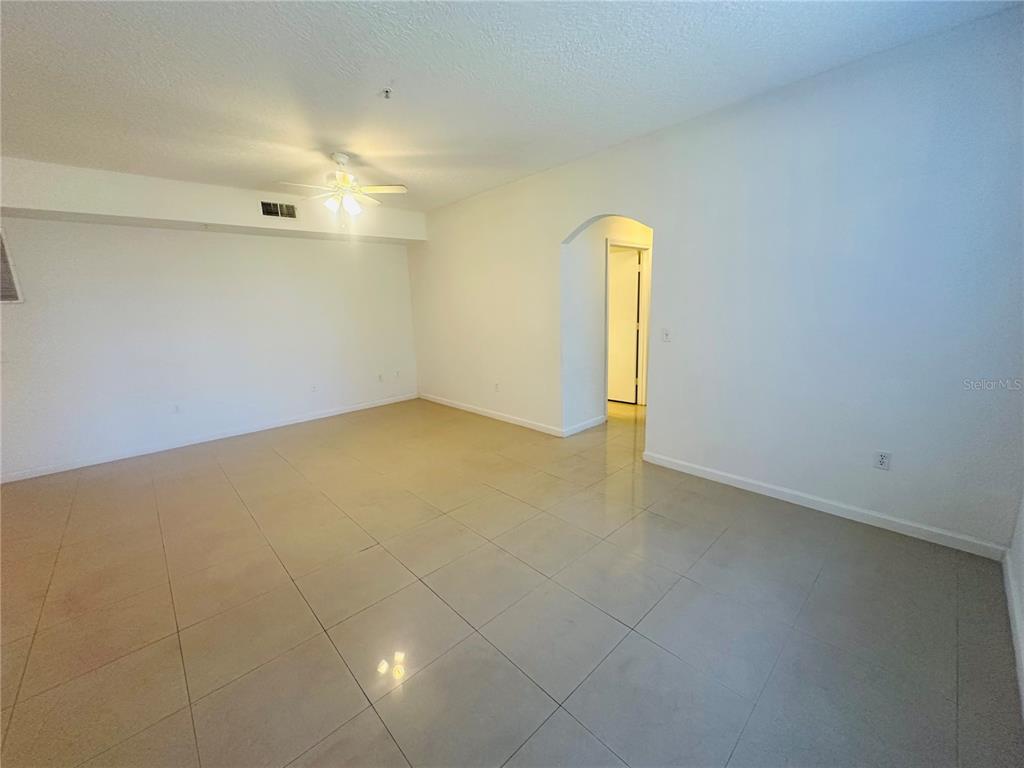 5560 Metrowest Boulevard, Unit 101 Orlando, FL 32811 - Photo 13 of 30 an empty room with a window