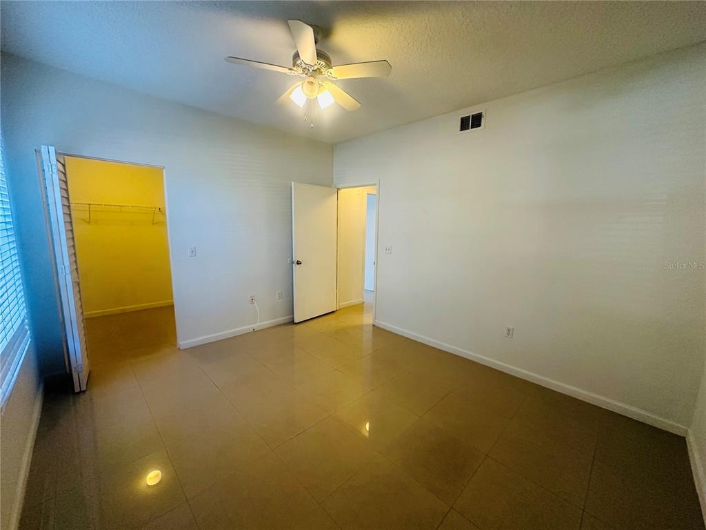 5560 Metrowest Boulevard, Unit 101 Orlando, FL 32811 - Photo 19 of 30 a view of an empty room with a window