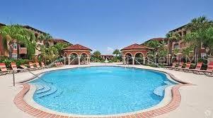 5560 Metrowest Boulevard, Unit 101 Orlando, FL 32811 - Photo 23 of 30 a view of a swimming pool with a yard