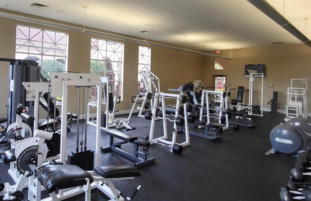 5560 Metrowest Boulevard, Unit 101 Orlando, FL 32811 - Photo 24 of 30 a view of a room with gym equipment
