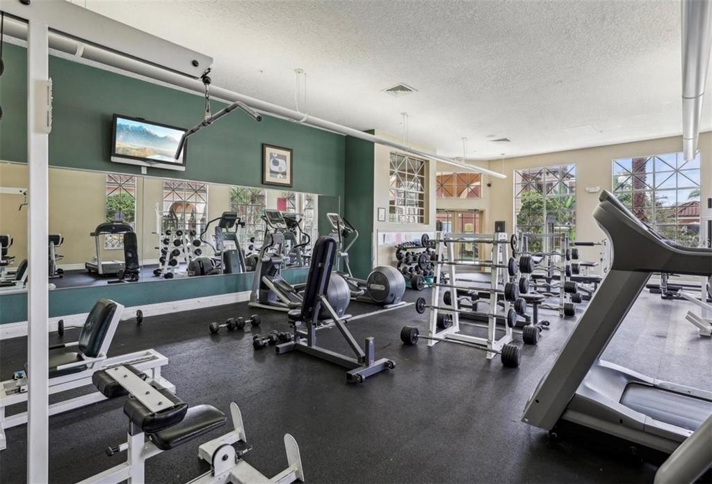 5560 Metrowest Boulevard, Unit 101 Orlando, FL 32811 - Photo 27 of 30 a view of a room with gym equipment