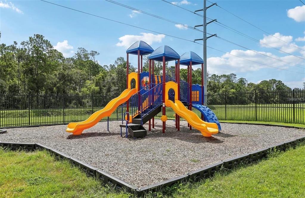 5560 Metrowest Boulevard, Unit 101 Orlando, FL 32811 - Photo 29 of 30 a view of a park with a slide