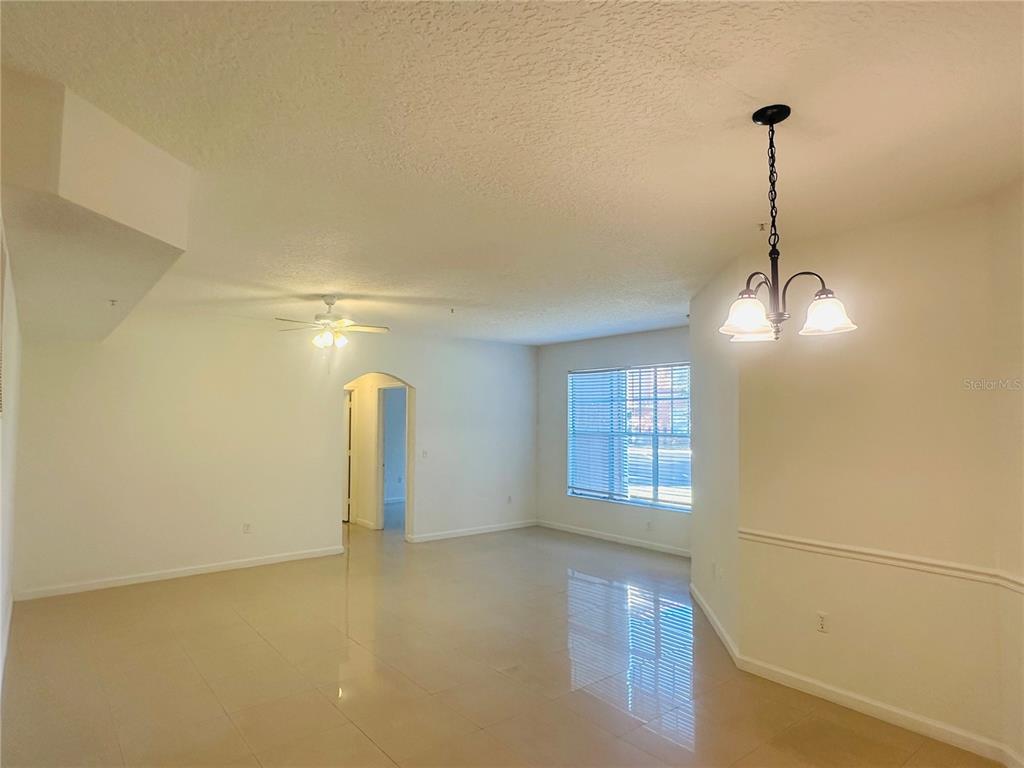 5560 Metrowest Boulevard, Unit 101 Orlando, FL 32811 - Photo 5 of 30 a view of a room with windows