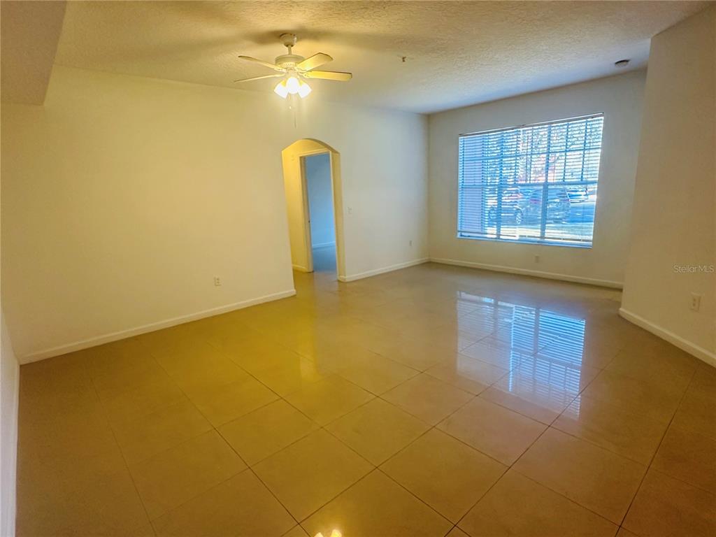 5560 Metrowest Boulevard, Unit 101 Orlando, FL 32811 - Photo 8 of 30 a view of an empty room with a window