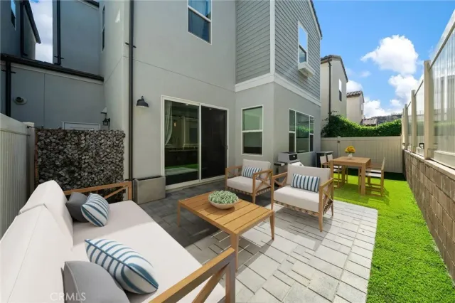 a view of a patio with couches table and chairs