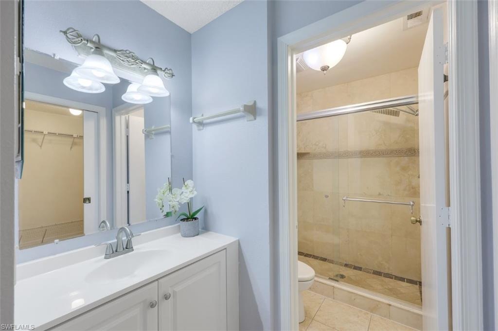 5685 Whitaker Road, Unit 202 Naples, FL 34112 - Photo 16 of 26 Features tiled walk in shower