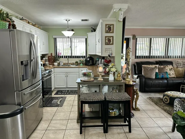 a kitchen with a refrigerator a stove a sink and dishwasher