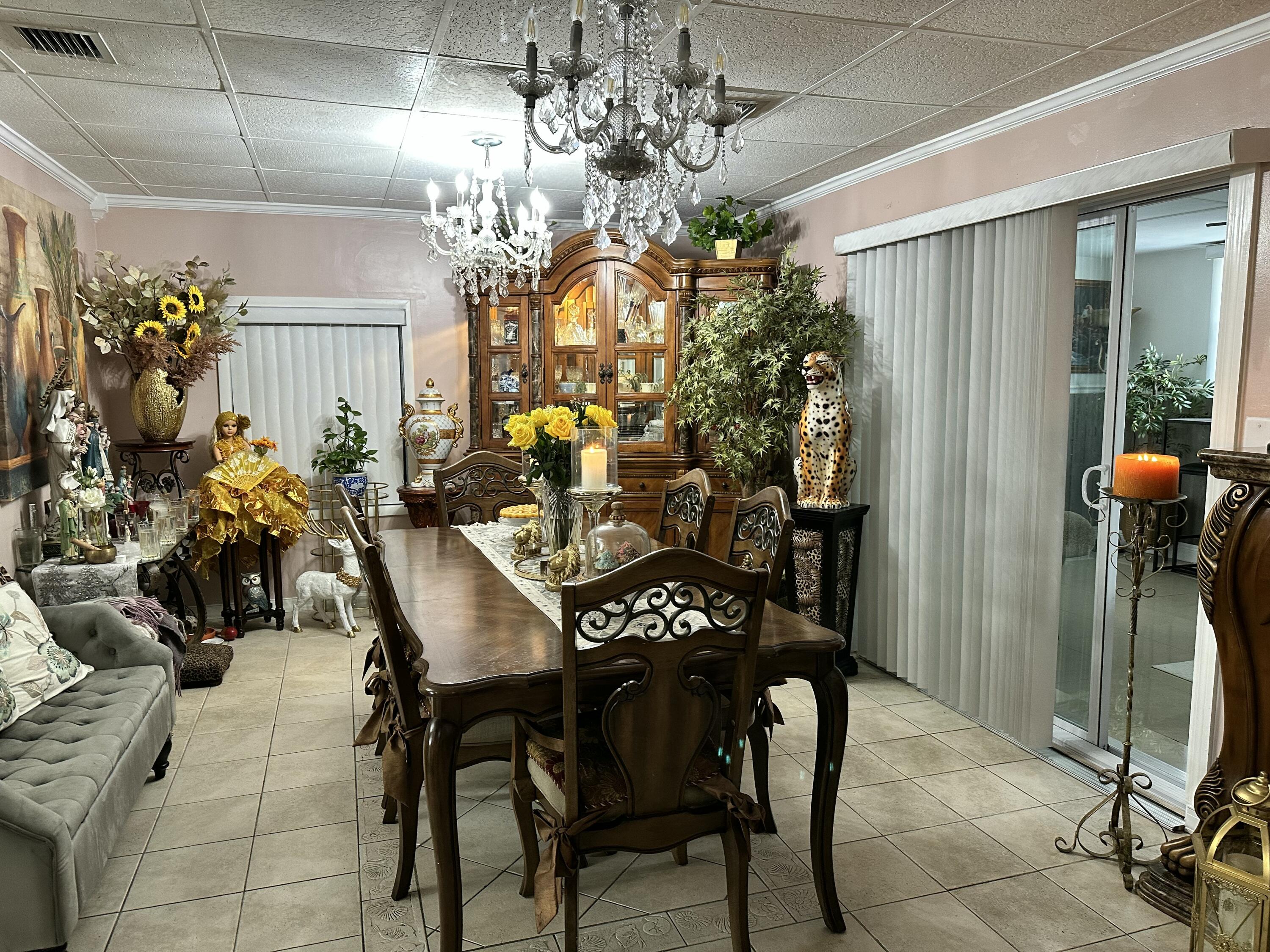 2922 Flagler Avenue Key West, FL 33040 - Photo 11 of 53 a view of a dining room with furniture and chandelier