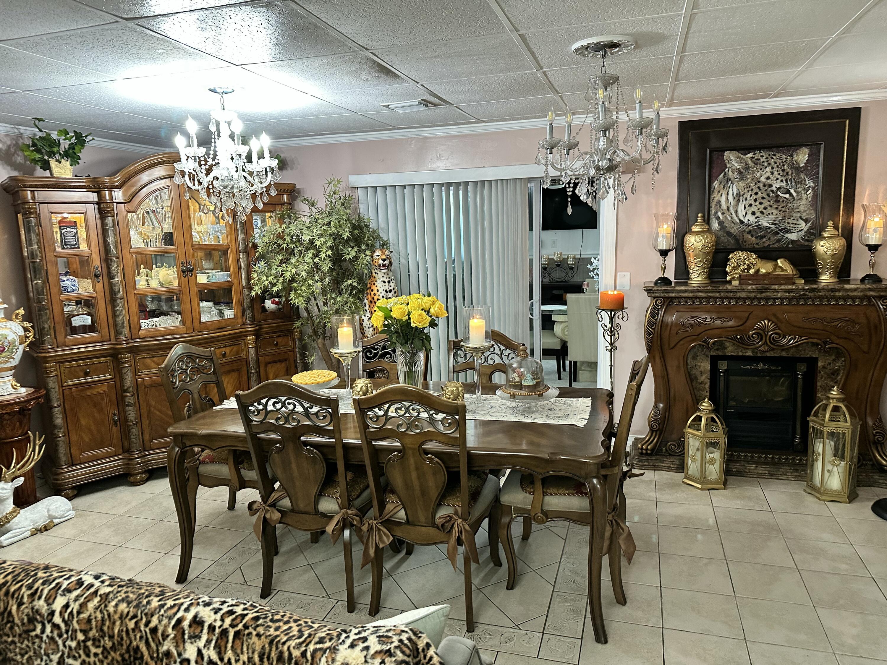 2922 Flagler Avenue Key West, FL 33040 - Photo 14 of 53 a view of a dining room with furniture a chandelier and window