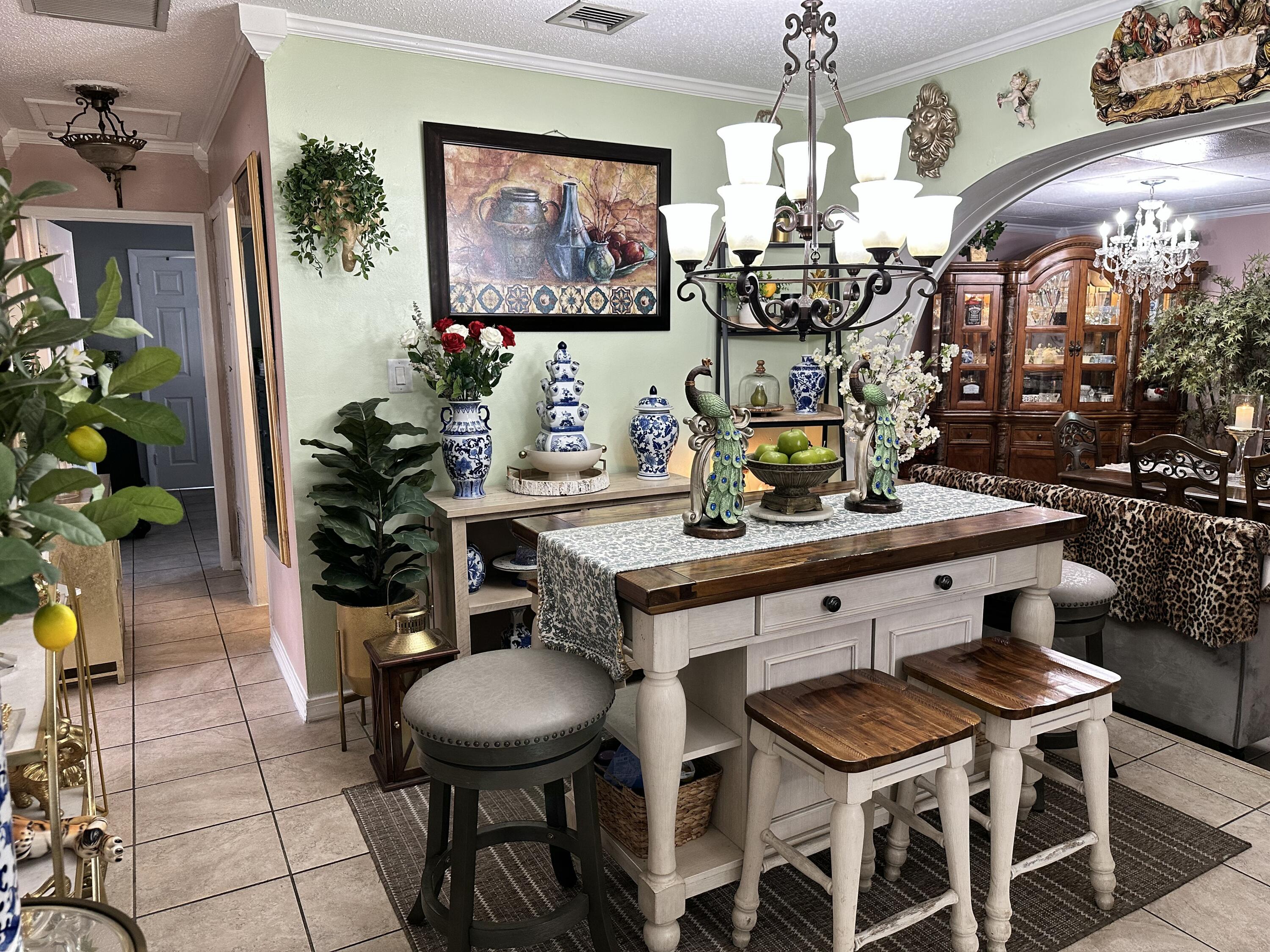 2922 Flagler Avenue Key West, FL 33040 - Photo 2 of 53 a room with furniture and a chandelier