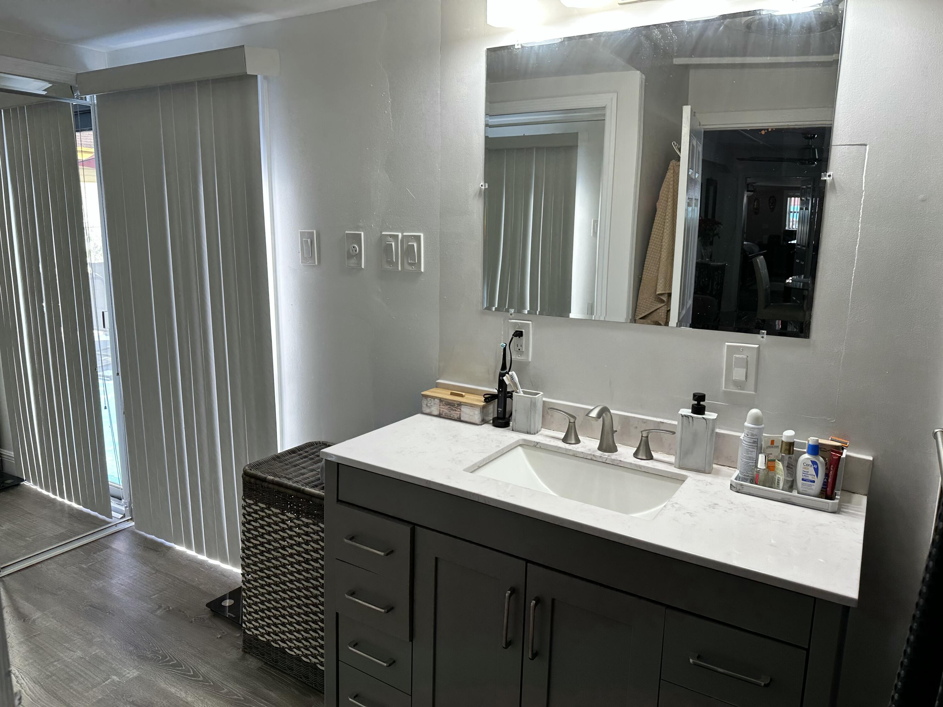 2922 Flagler Avenue Key West, FL 33040 - Photo 23 of 53 a bathroom with a sink and a mirror