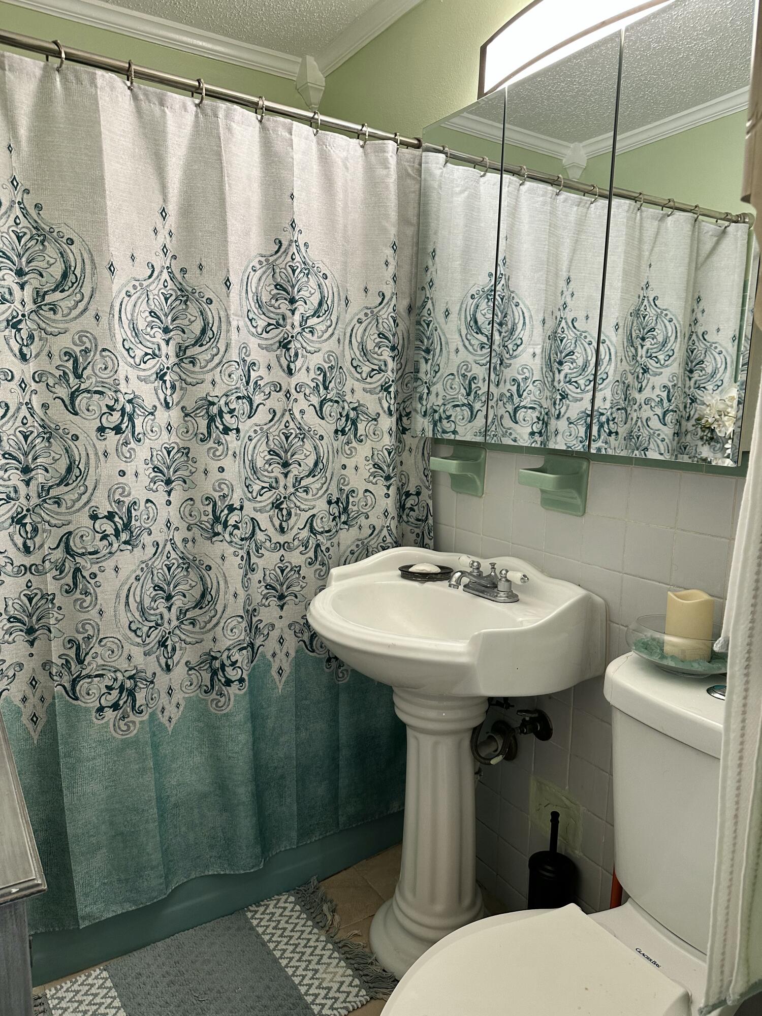 2922 Flagler Avenue Key West, FL 33040 - Photo 25 of 53 a bathroom with a sink toilet and shower