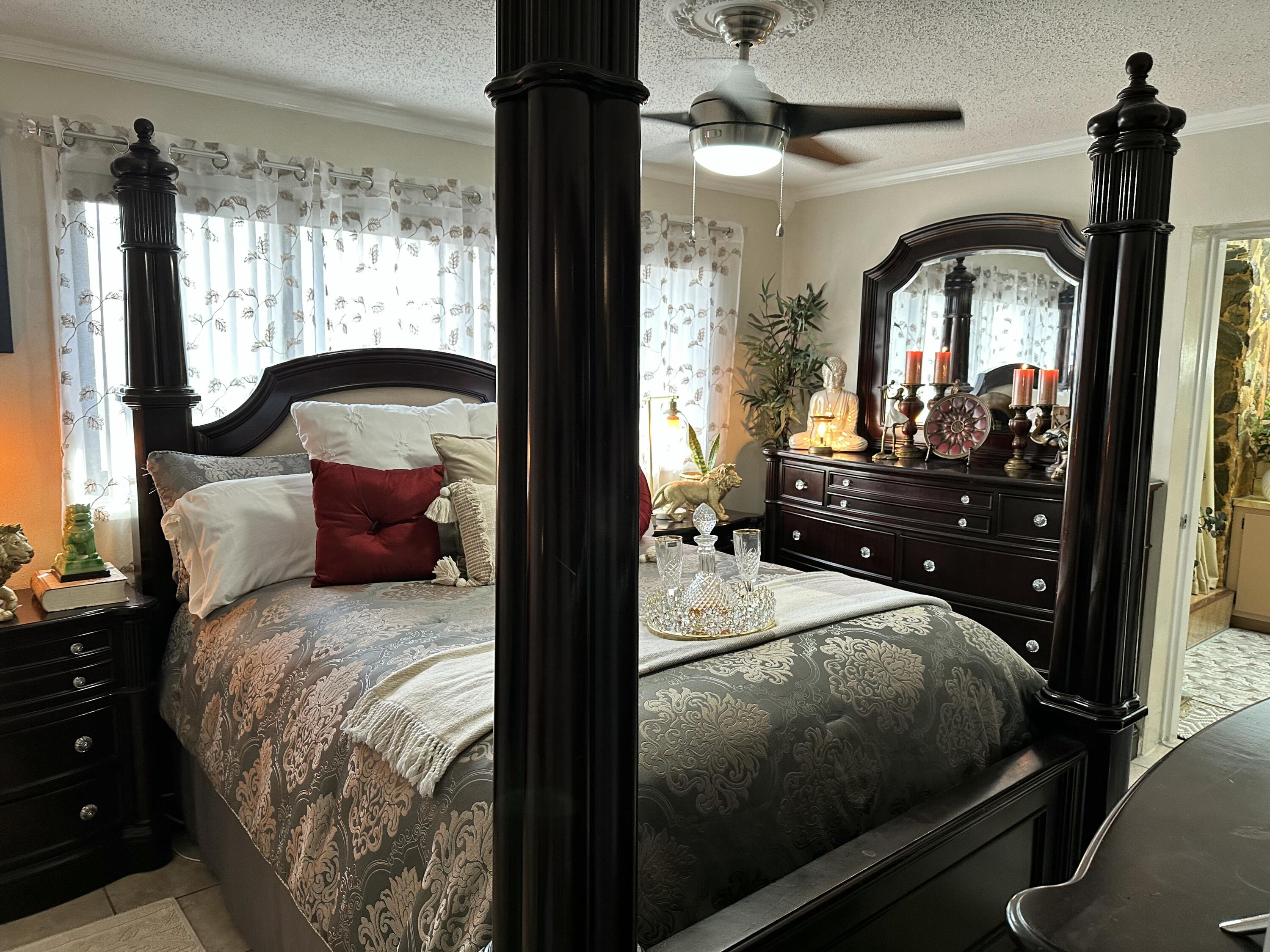 2922 Flagler Avenue Key West, FL 33040 - Photo 26 of 53 a bedroom with a bed and a mirror